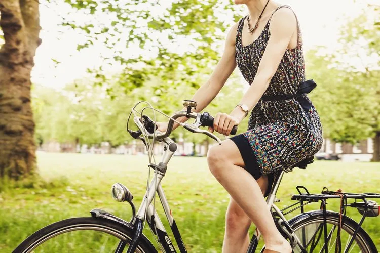 Millennial riding a bike