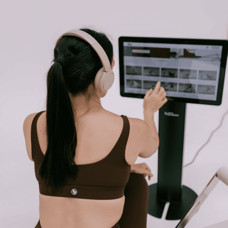 Women selecting workout routine